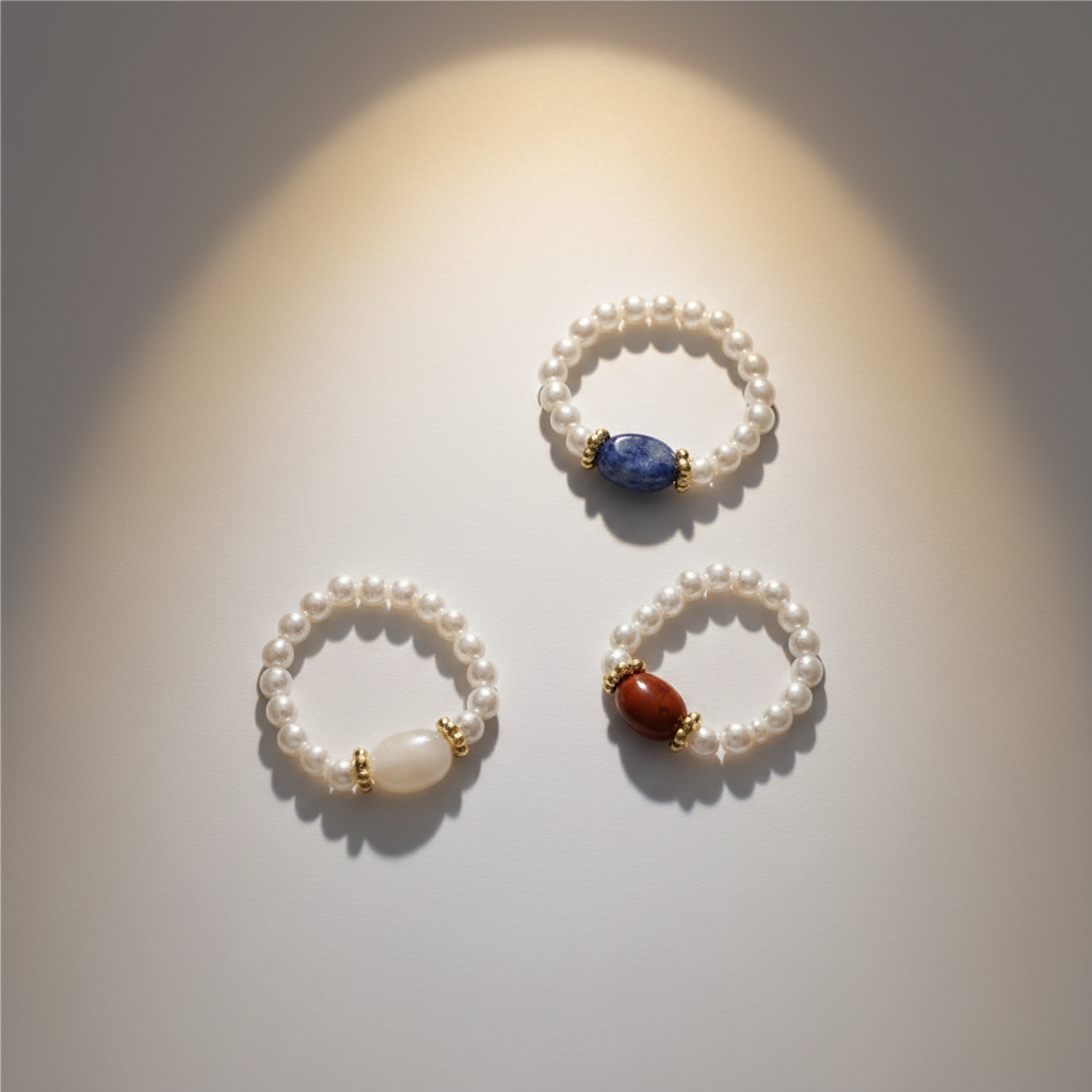All three pearl rings white background